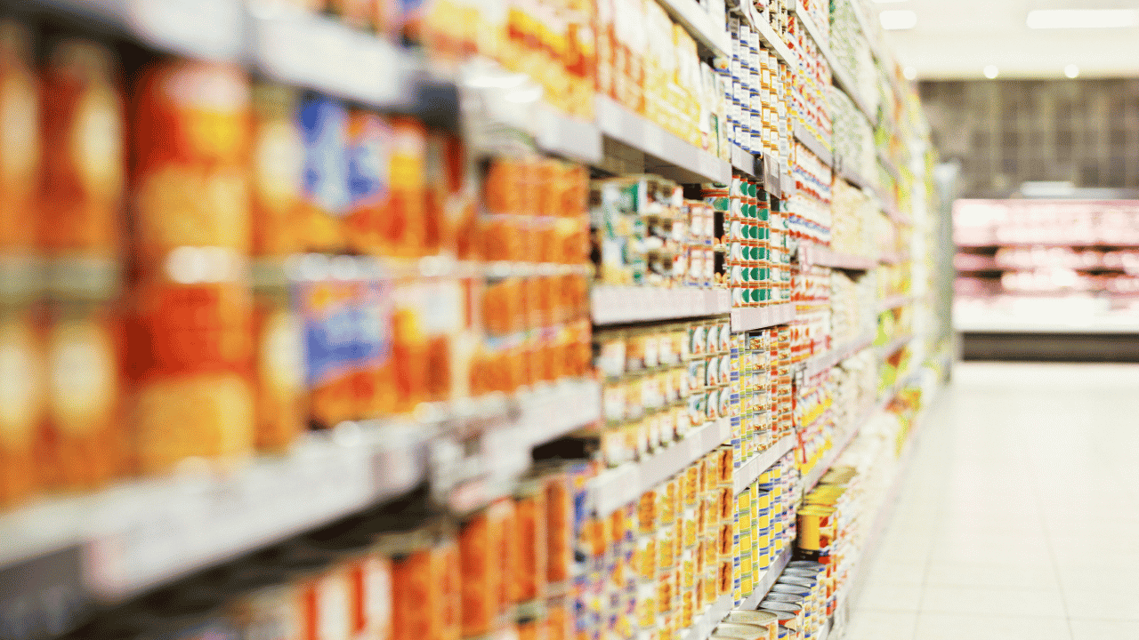 Grocery store shelves with packages foods on display