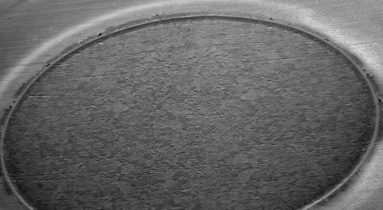 Glow Discharge sample closeup example of sputtered surface