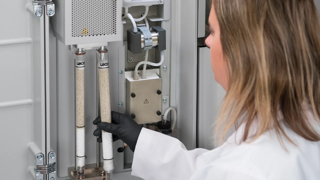 lab technician replacing equipment parts