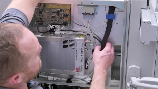 LECO Service Technician evaluating instrument electronics