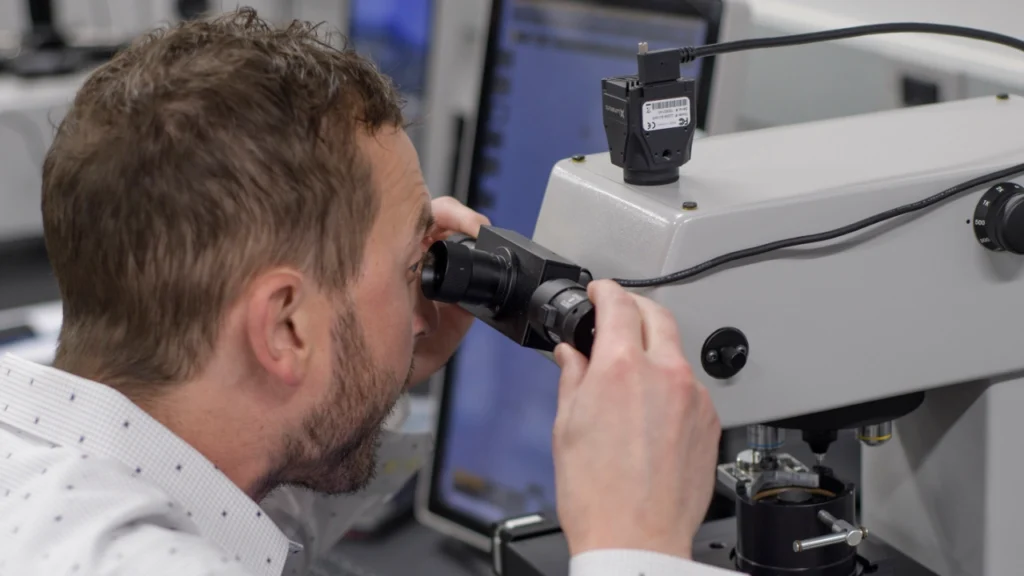 LECO technician adjusting hardness tester