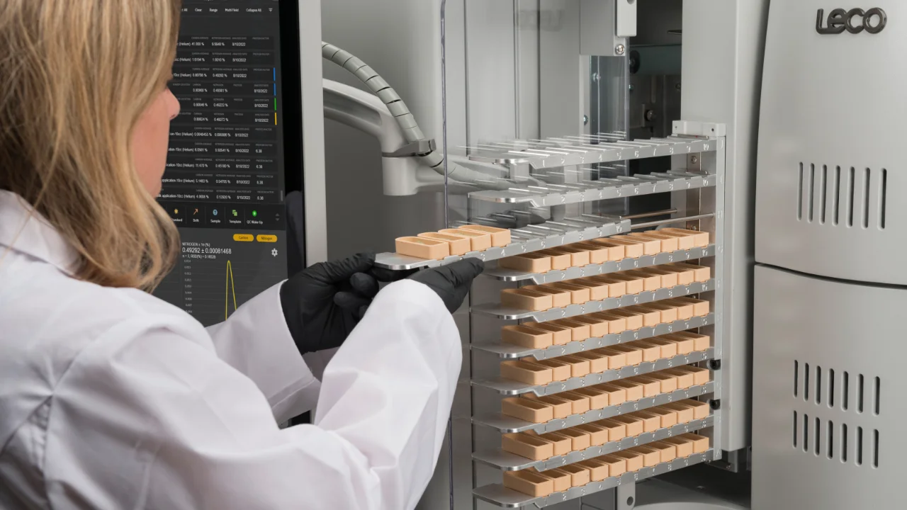 Scientist loading samples into autoloader