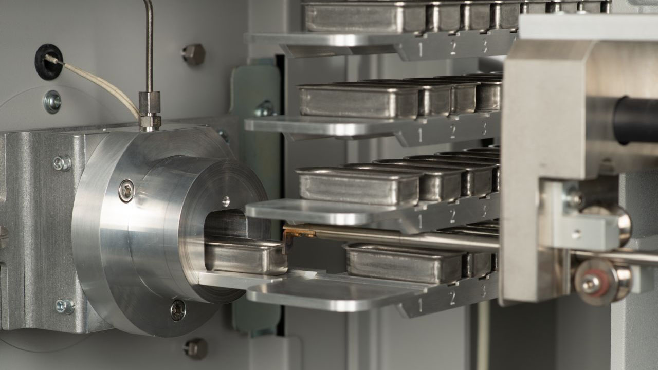 Close up of LECO CM812 sample auto-loader