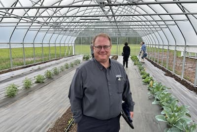 LECO chemist Lloyd Allen in a greenhouse